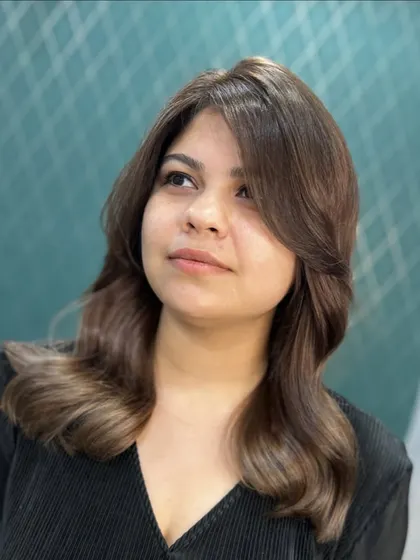 A new hue that feels fabulous. This client is glowing with her sun-kissed highlights and rich, glossy brown color.