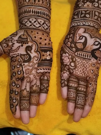 Another angle of the peacock design, showing how the patterns on both hands are similar but not exactly identical, which adds interest.