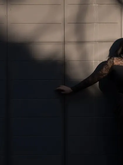 An artistic portrait of the bride using the strong shadows and warm light of the setting sun. This play of light and dark creates a moody and high-fashion feel.