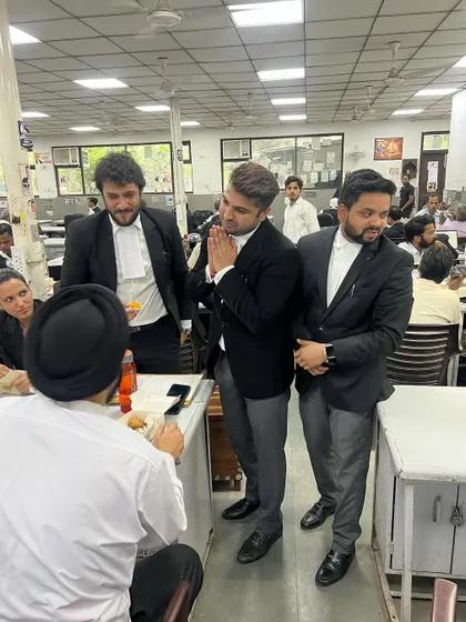 Greeting a senior advocate with a 'namaste' as a sign of respect.