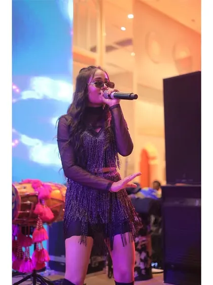 Another shot of our amazing female vocalist, owning the stage. Our diverse lineup of singers allows us to cover a wide range of musical styles.