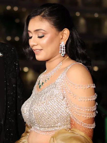 A side view of the bride's sangeet makeup, highlighting the glowing cheekbones and soft eyeshadow.