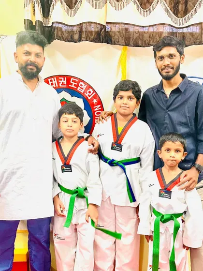 A family of students with their new belts.