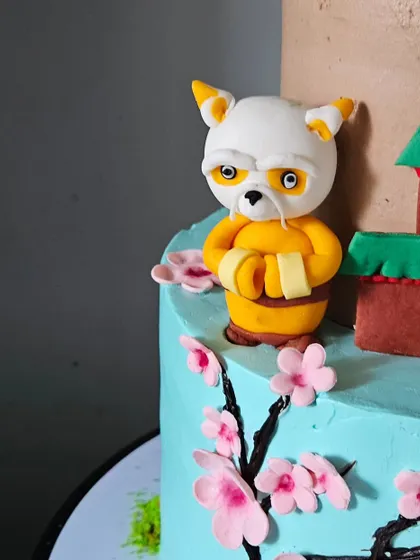 A close-up of the Master Shifu figurine. Capturing the stern but wise expression of the character was a key part of bringing this cake to life.
