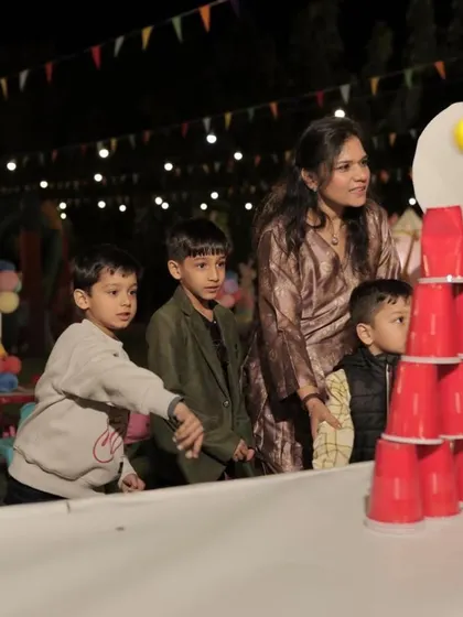 Kids enjoying a classic cup stacking carnival game. I can arrange a variety of game booths to suit your theme.