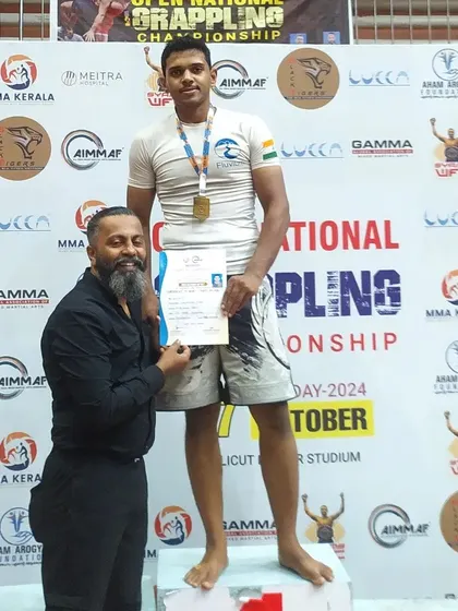 On the podium after winning gold. It's always great to share these moments with friends and fellow competitors.