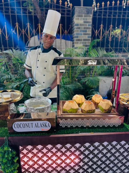 My Coconut Alaska dessert station, where a chef prepares a unique tropical-themed sweet treat.