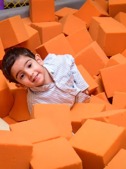 Peek-a-boo from the foam block pit! This is one of my favorite spots for kids to jump and play safely.