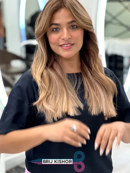 Another look at this stunning and unique creamy peach ash blonde. The color is soft, dimensional, and perfectly on-trend.
