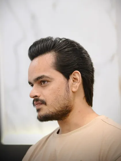 This is the modern wolf cut. It's a heavily layered style that creates tons of texture and movement, perfect for guys who want an edgy, untamed look.