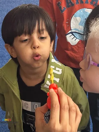 A moment of shared wonder over bubbles helps new children connect with each other and feel at ease.