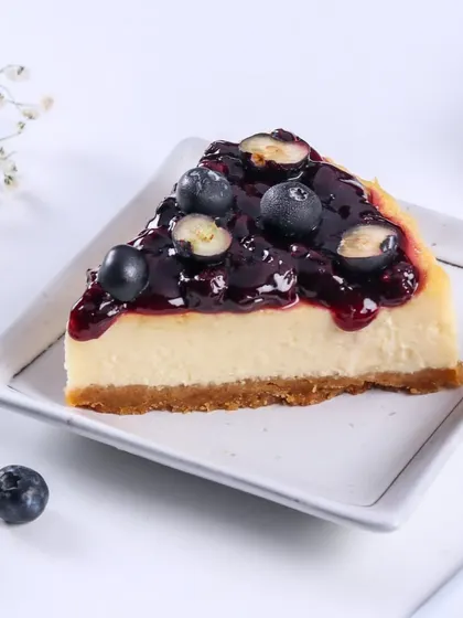 Here is a slice of my Blueberry Cheesecake. The tartness of the blueberry compote cuts through the richness of the creamy cheesecake beautifully.