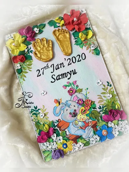 A truly special piece where I restored a client's damaged baby hand and footprints and incorporated them into a new, beautiful wall art with a cute bunny theme.