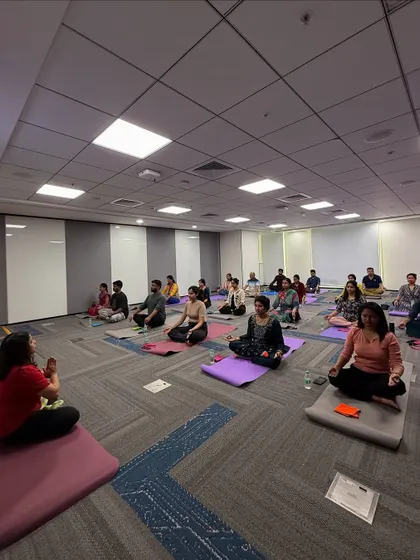 Guiding a large group at Manhattan Associates through a seated twist. These poses are excellent for spinal mobility and are easily practiced in an office setting.