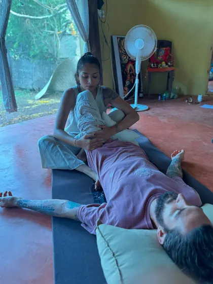 A gentle, assisted twist during my bodywork training. This movement helps to mobilize the spine and release tension along the back.