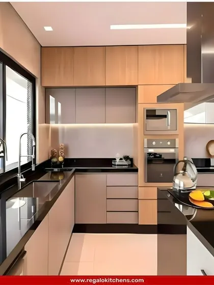 A beautiful L-shaped kitchen that pairs light wood-toned lower cabinets with beige upper cabinets. The black countertop and sink create a striking contrast, and the layout is optimized for a smooth cooking experience.