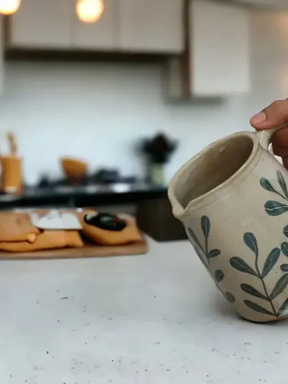 I love seeing my pieces in their new homes. This handmade ceramic jug with a leaf motif is perfect for everyday use, adding a touch of elegance to the kitchen.