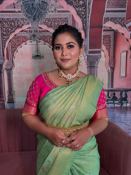 A pre-pleated saree in a lovely pastel green. This modern service makes wearing a saree quick and effortless.