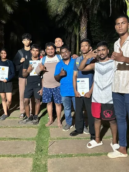 The support team celebrating with our fighters after a successful event. We are a family, and we cheer for each other's victories.