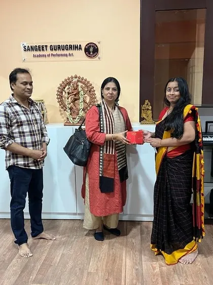 A moment of gratitude, presenting a token of appreciation to one of our esteemed examiners.