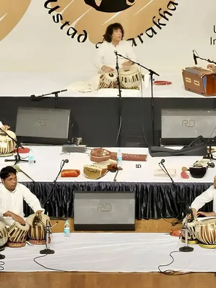 Performing as part of a large tabla ensemble led by Ustad Zakir Hussain. The collective energy of so many tablas playing in unison was a powerful tribute to our shared Guru, Abbaji.