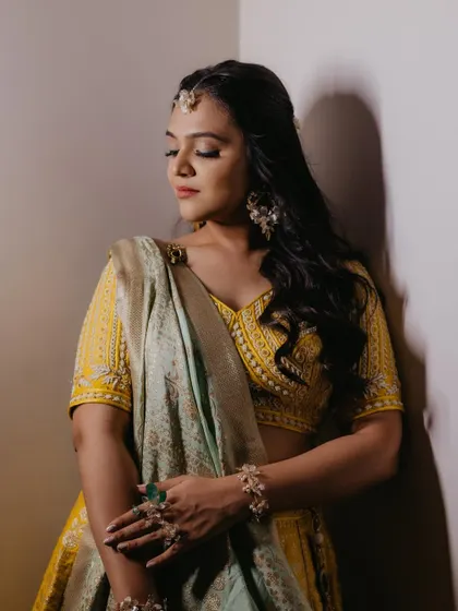 Portraits of my prettiest bride for her Haldi. The makeup is classic and classy, with a focus on flawless skin and defined eyes.