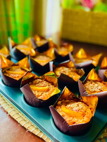 Why should kids have all the fun? A school teacher ordered six dozen of these spiced peach and carrot whole wheat muffins to celebrate her birthday with her colleagues.