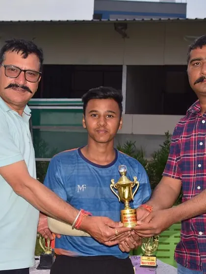 Aryan Mhase receiving his Man of the Match and Player of the Series awards for the junior team in Dehradun.