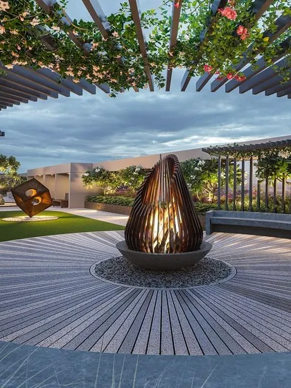 This 3D concept shows a captivating gathering space on a terrace. A circular concrete bench envelops a central fire pit, all under a trellis designed for bougainvillea to create a flowering canopy.