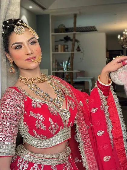 A beautiful shot highlighting the detailed blouse and heavy jewellery of a traditional Punjabi bride, all available for rent.