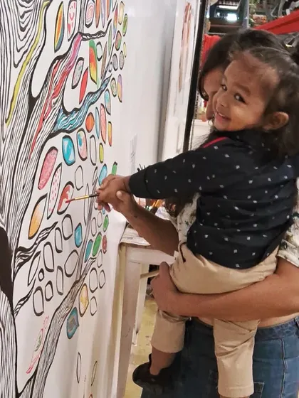 Even the littlest artists can make a big impact! It was so heartwarming to see this child adding their mark to our community mural.