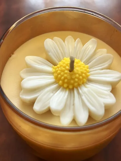 A close-up of the daisy flower topping on one of my candles. The center is a different shade of yellow, just like a real daisy.