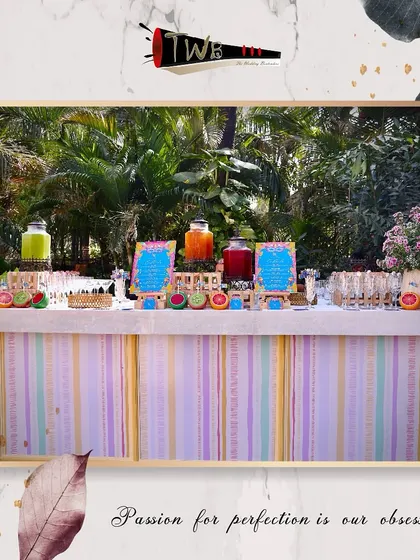 A wide view of our pastel-themed mocktail bar, perfect for a daytime celebration with its light and airy feel.