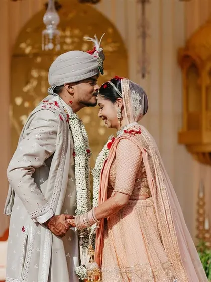 A tender forehead kiss. These are the quiet, intimate moments that we ensure are captured amidst all the wedding chaos.