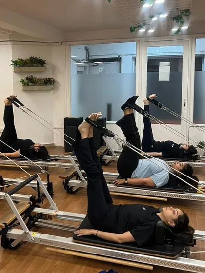 Various shots of members and instructors in action during our dynamic Reformer Pilates classes.
