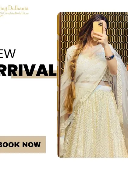 A mirror selfie showing off a beautiful white and gold lehenga. It's a great option for pre-wedding shoots or your engagement ceremony.