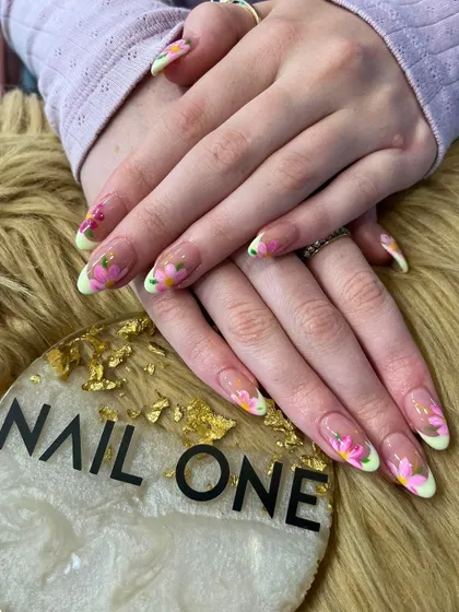 This beautiful floral design features hand-painted pink flowers on a sheer base with soft green tips. It's a fresh, garden-inspired look perfect for any season.