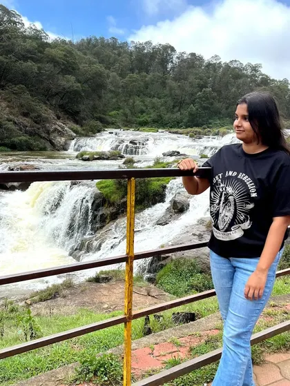 Taking in the view at Pykara Falls. It's a perfect spot for photos and enjoying the power of nature.