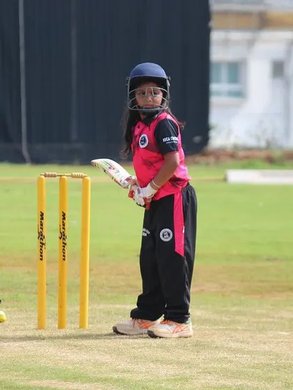 A batter and wicketkeeper in action during a U-10 game, showcasing the focus and enthusiasm of our youngest cricketers.