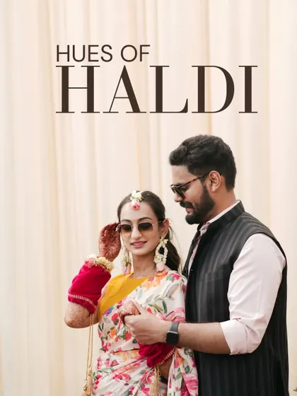 A cool and stylish portrait of the couple in their sunglasses, perfectly capturing the fun and modern vibe of their "Hues of Haldi" celebration.