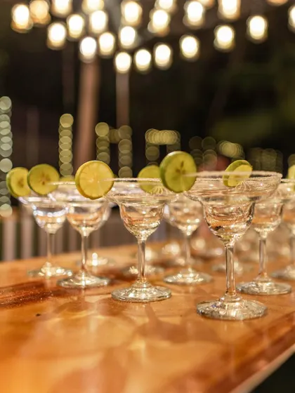 It's all in the details. Margarita glasses are lined up and ready at our custom-designed bar, ensuring guests are served with style and efficiency.