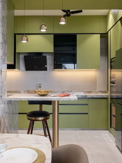 This perspective shows the kitchen's tall unit, which houses the built-in oven and provides additional storage, all while maintaining a clean, cohesive look with the rest of the home's decor.
