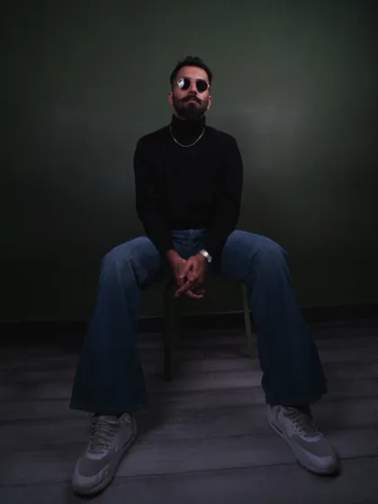A full-length studio shot showcasing my preferred silhouette with a black turtleneck and vintage-inspired wide-leg jeans. This look is ideal for classic men's apparel campaigns.