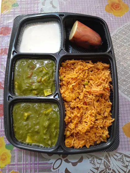 Another one of my healthy meal combinations. This box has vegetable pulao, Palak Paneer, and a whole boiled sweet potato for extra nutrition.