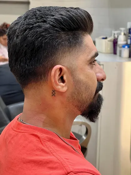 Elevate your style with a perfect fade. This cut is classic, sharp, and always in style.