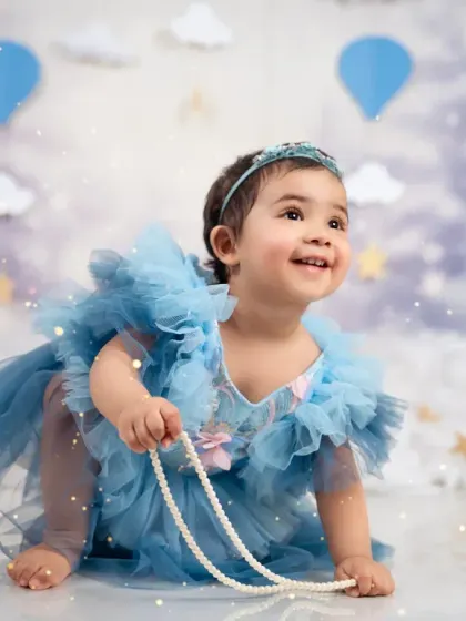 Looking up at a future full of wonder. This candid shot from a first birthday session captures pure innocence.