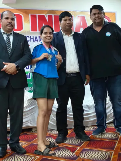 One of our female students receiving her medal at the National Kickboxing Championships.