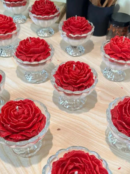 A collection of my red peony candles in glass dessert cups, one of my bestselling designs for wedding gifts. The vibrant red and detailed petals make a bold and beautiful statement.