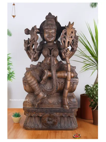 A 36-inch sculpture of Goddess Kamatchi holding a sugarcane bow, a symbol of the sweetness of life and the mind. The antique brown finish gives it a classic, elegant look.
