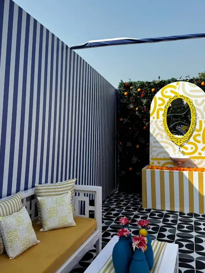 From concept to execution in just 42 hours. This St. Tropez inspired decor in Ahmedabad involved transforming a bungalow with custom-painted walls, fruit-based installations, and unique props, all on a tight deadline.